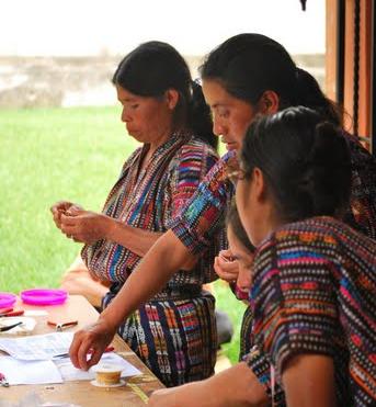 (From Left) Marcela Quisquiná, Petrona Chiroy Morales, and Emilia Raxtin, from the cooperative Artesanas Mayas, creating designs for Bloomie’s Trunk Show